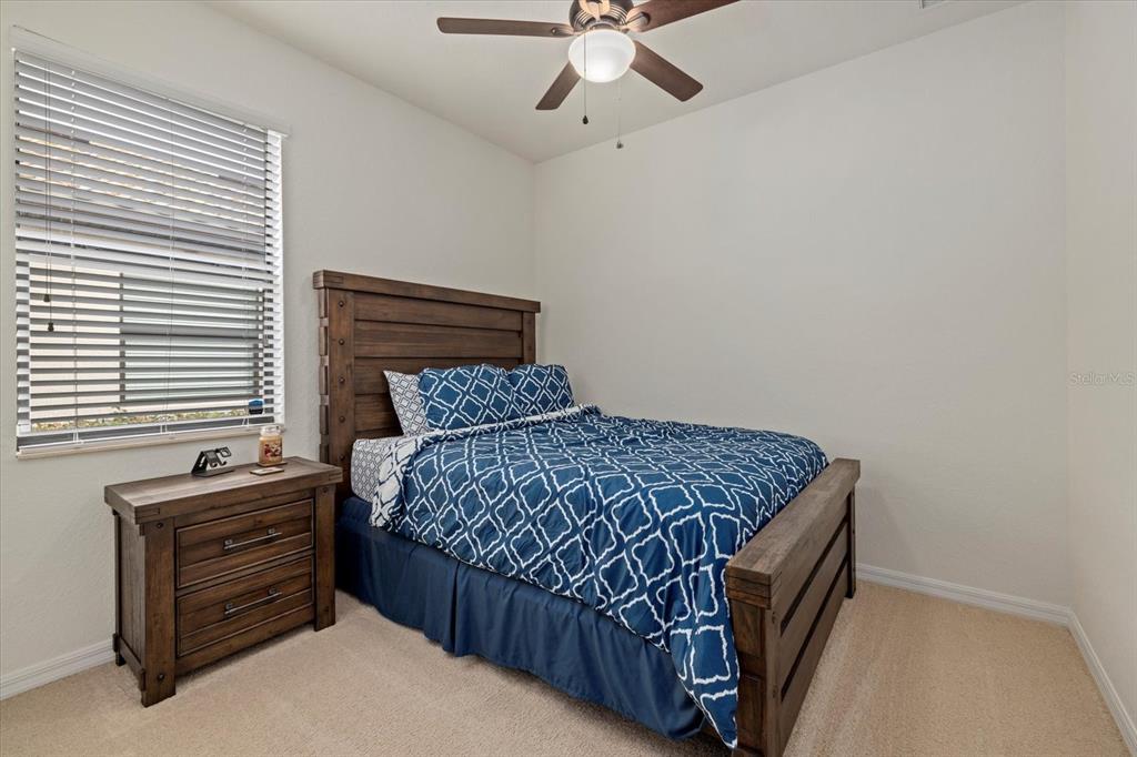 17018 Blue Rdg Place Bradenton, FL 34211 - Photo 21 of 34 a bedroom with a bed a window and closet