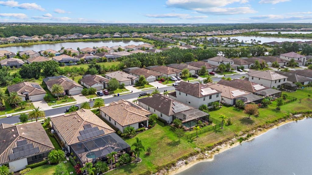 17018 Blue Rdg Place Bradenton, FL 34211 - Photo 28 of 34 an aerial view of residential houses with outdoor space and river