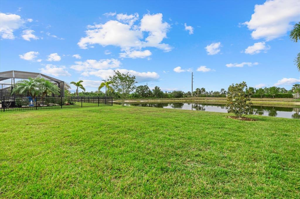 17018 Blue Rdg Place Bradenton, FL 34211 - Photo 3 of 34 a view of a fountain in front of a house with a big yard