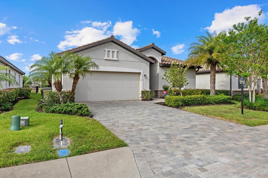 17018 Blue Rdg Place Bradenton, FL 34211 - Photo 32 of 34 a front view of a house with garden