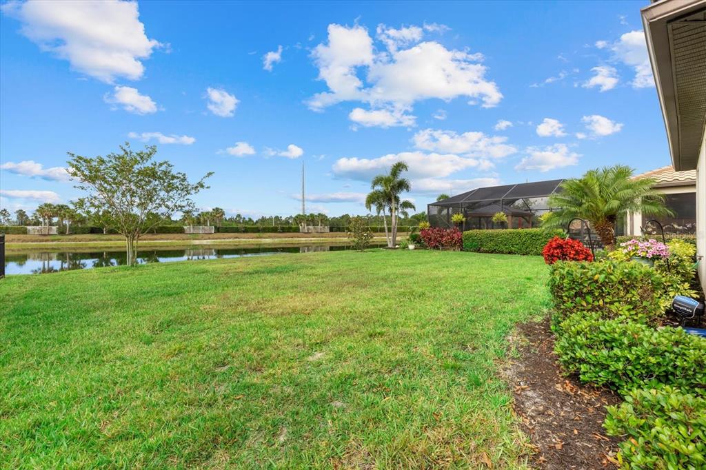 17018 Blue Rdg Place Bradenton, FL 34211 - Photo 33 of 34 a view of a house with a big yard and potted plants
