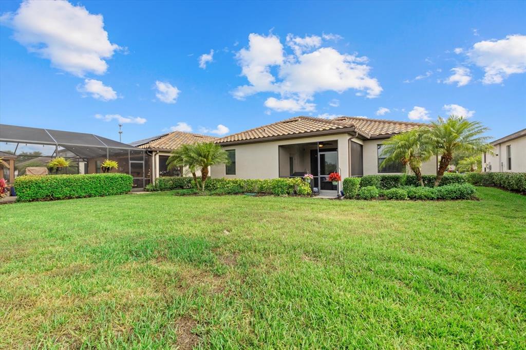 17018 Blue Rdg Place Bradenton, FL 34211 - Photo 34 of 34 a front view of house with yard and green space