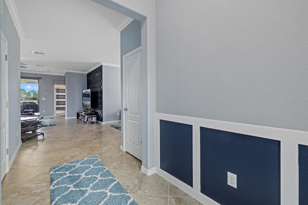 17018 Blue Rdg Place Bradenton, FL 34211 - Photo 5 of 34 a view of a hallway with furniture and a living room