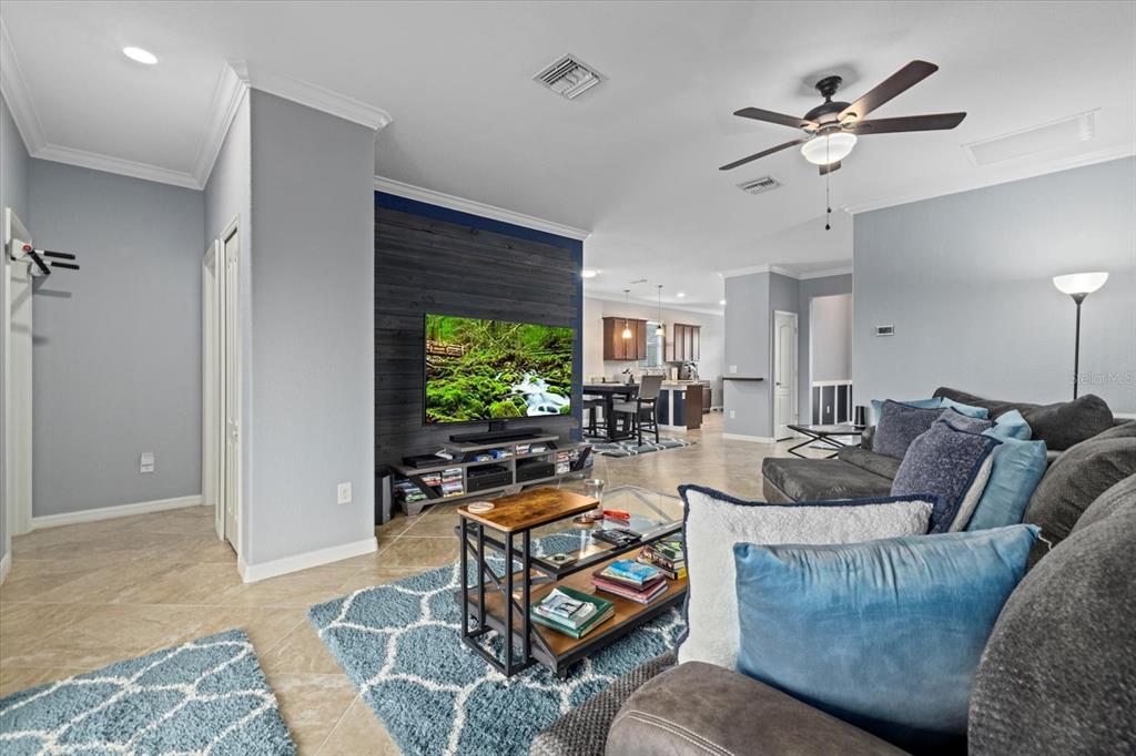 17018 Blue Rdg Place Bradenton, FL 34211 - Photo 7 of 34 a living room with furniture and a flat screen tv