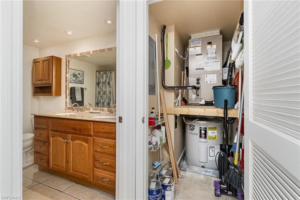 5535 Rattlesnake Hammock Road, Unit 103 Naples, FL 34113 - Photo 16 of 25 Guest Bathroom and utility closet