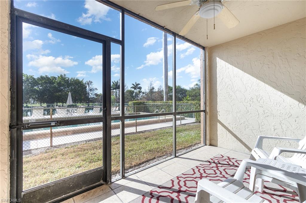 5535 Rattlesnake Hammock Road, Unit 103 Naples, FL 34113 - Photo 18 of 25 Fully screened-in lanai/patio with gorgeous view of pool, golf course and lush landscape.