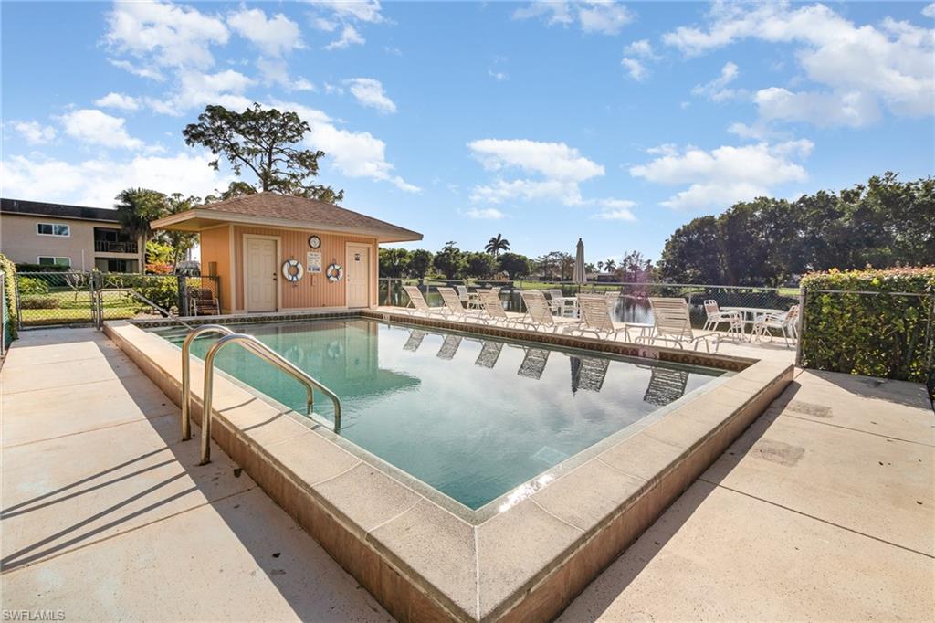 5535 Rattlesnake Hammock Road, Unit 103 Naples, FL 34113 - Photo 20 of 25 View of pool with sundeck, patio and restrooms.