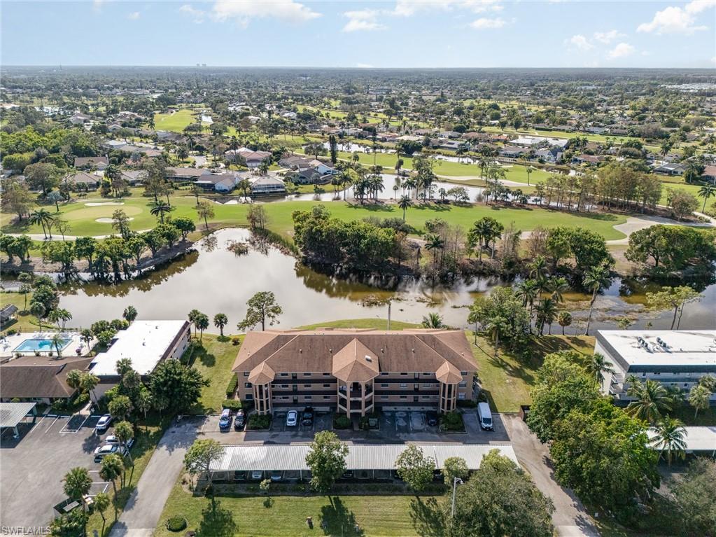 5535 Rattlesnake Hammock Road, Unit 103 Naples, FL 34113 - Photo 21 of 25 Birds eye view of property with a water view