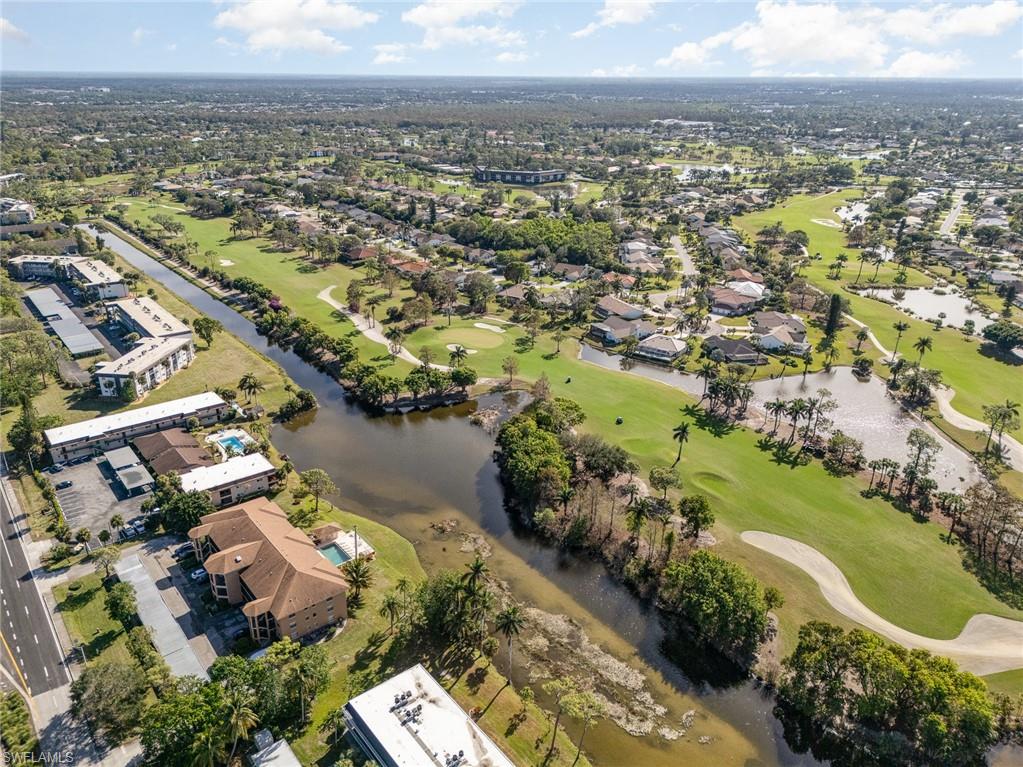 5535 Rattlesnake Hammock Road, Unit 103 Naples, FL 34113 - Photo 23 of 25 Birds eye view of property with a water view