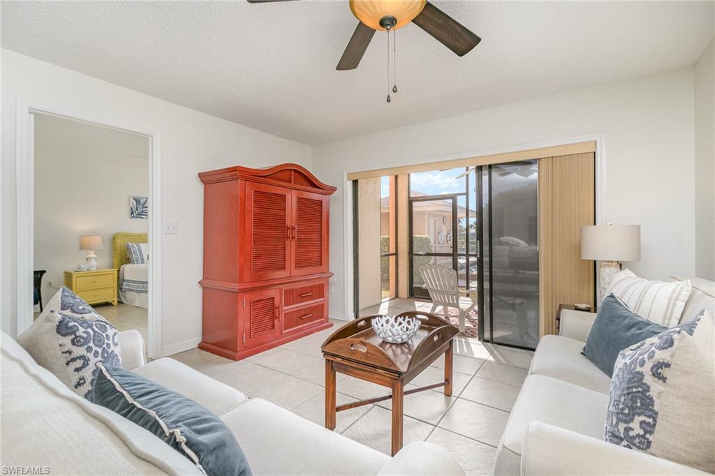 5535 Rattlesnake Hammock Road, Unit 103 Naples, FL 34113 - Photo 3 of 25 Living room with view of primary bedroom.
