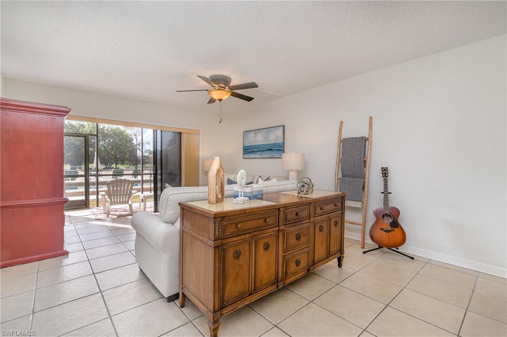 5535 Rattlesnake Hammock Road, Unit 103 Naples, FL 34113 - Photo 4 of 25 View from dining area looking toward family room and lanai.