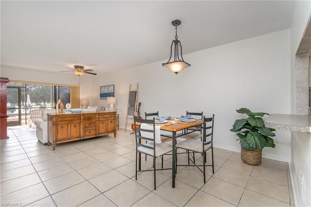 5535 Rattlesnake Hammock Road, Unit 103 Naples, FL 34113 - Photo 5 of 25 Spacious Dining area including breakfast bar.
