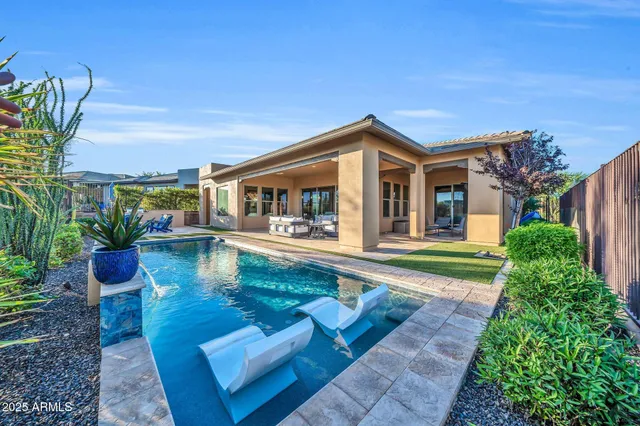 a spacious bathroom with a double vanity sink and a mirror