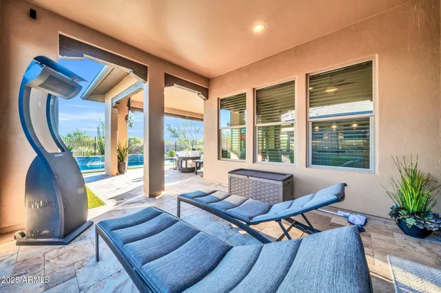 a view of swimming pool with outdoor seating