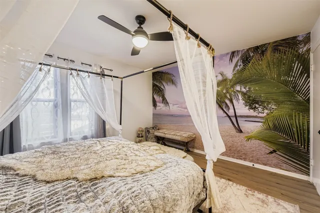 a bedroom with a bed and a mirror