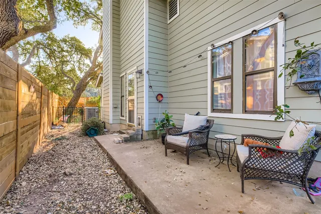 a view of a patio with a table and chairs