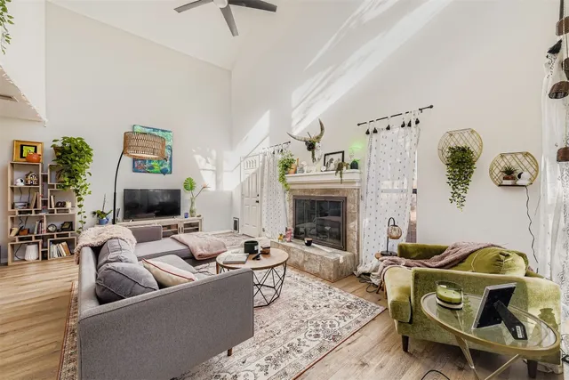 a living room with furniture and a fireplace