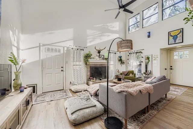 a living room with furniture and a fireplace