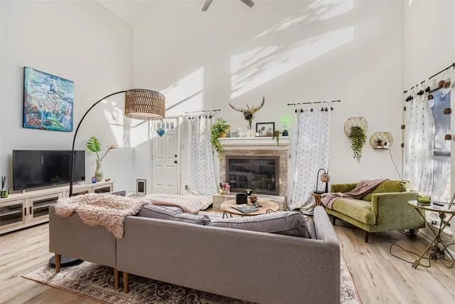 a living room with furniture and a flat screen tv