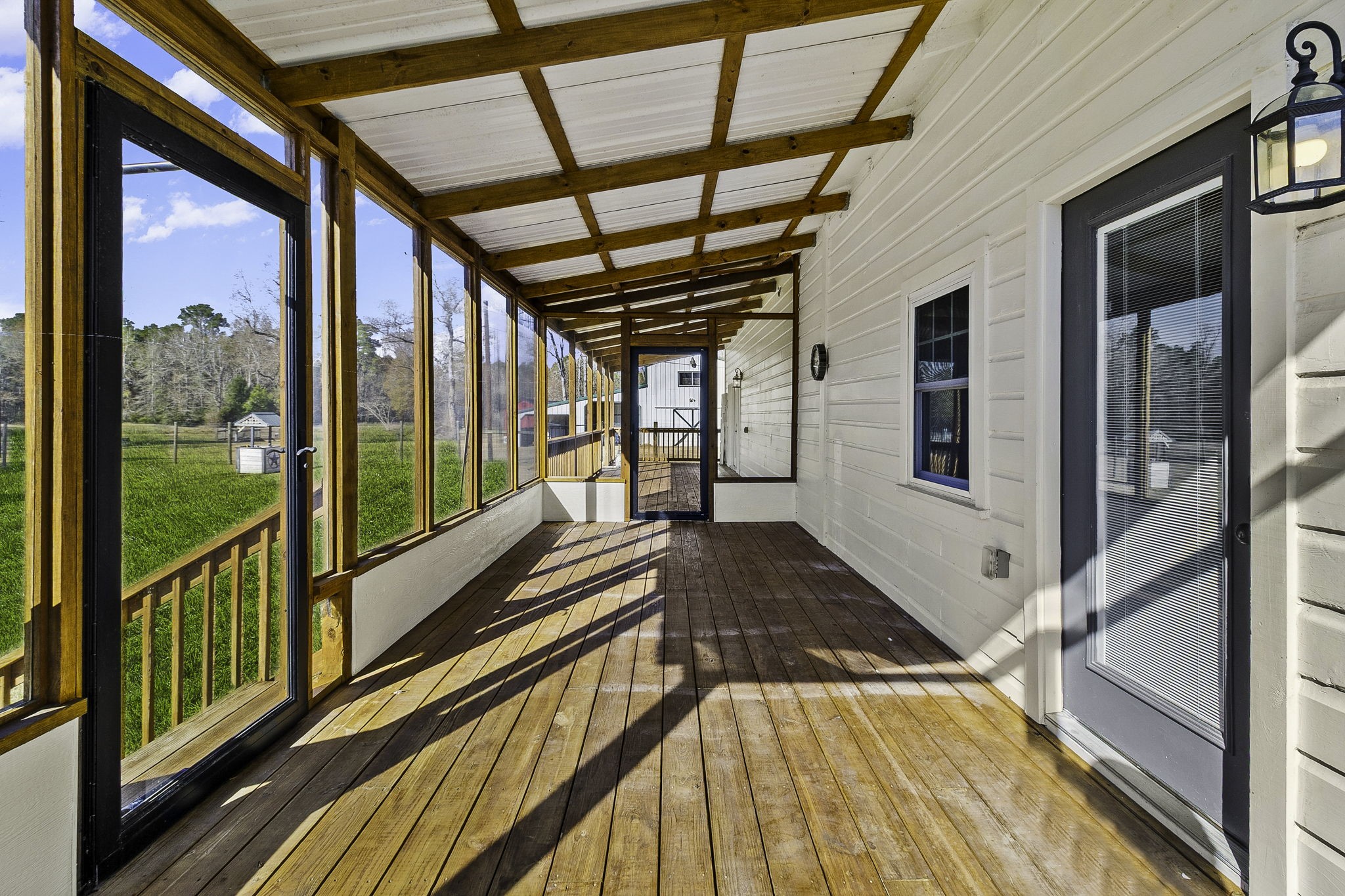 500 Highway 156 Point Blank, TX 77364 - Photo 32 of 50 Back porch runs the length of the house.