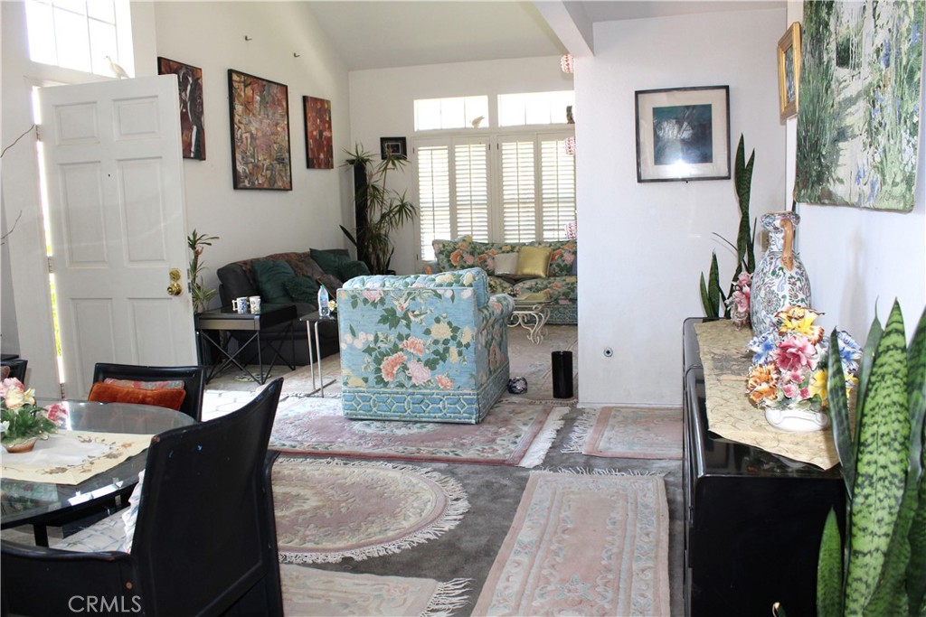21 Wellesley, Unit 24 Irvine, CA 92612 - Photo 5 of 31 a living room with furniture and a potted plant