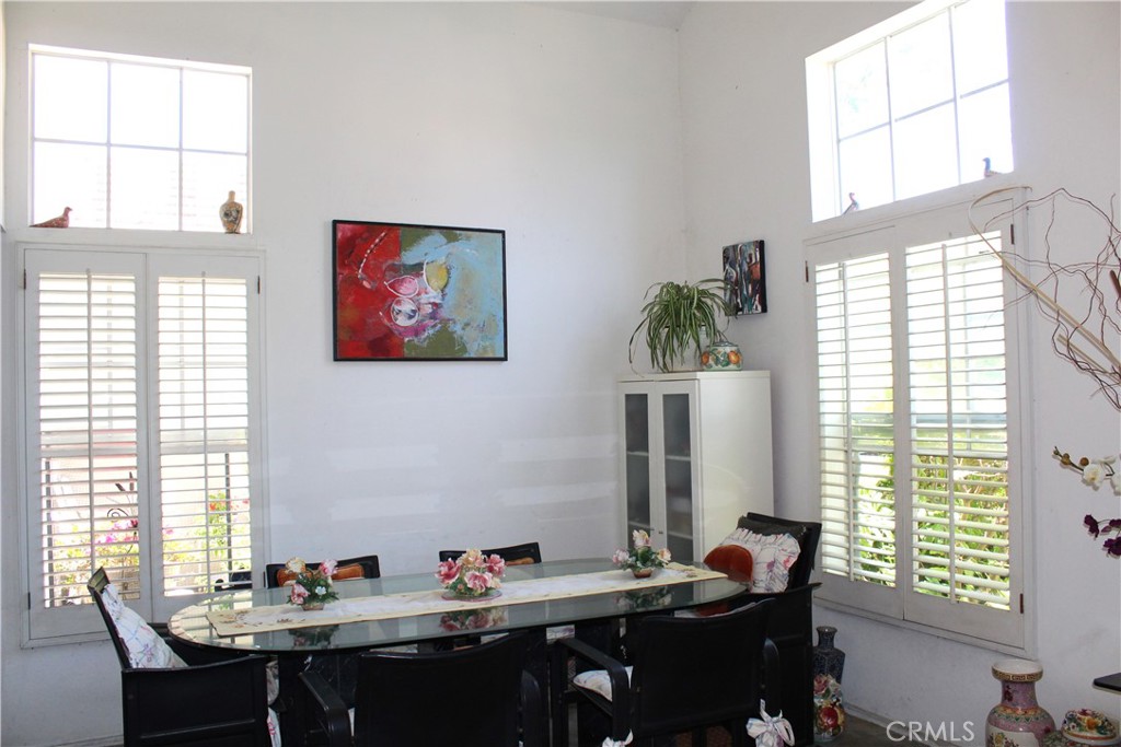 21 Wellesley, Unit 24 Irvine, CA 92612 - Photo 7 of 31 a view of a dining room with furniture and window