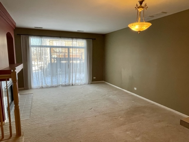 2459 Oneida Lane Naperville, IL 60563 - Photo 5 of 14 a view of an empty room with a window