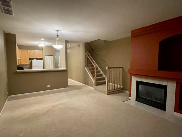 2459 Oneida Lane Naperville, IL 60563 - Photo 6 of 14 a view of an empty room with a fireplace