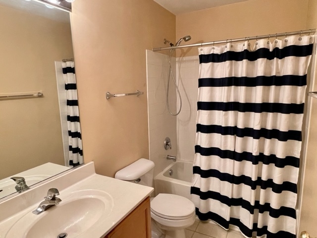 2459 Oneida Lane Naperville, IL 60563 - Photo 9 of 14 a bathroom with a sink a toilet and shower curtain