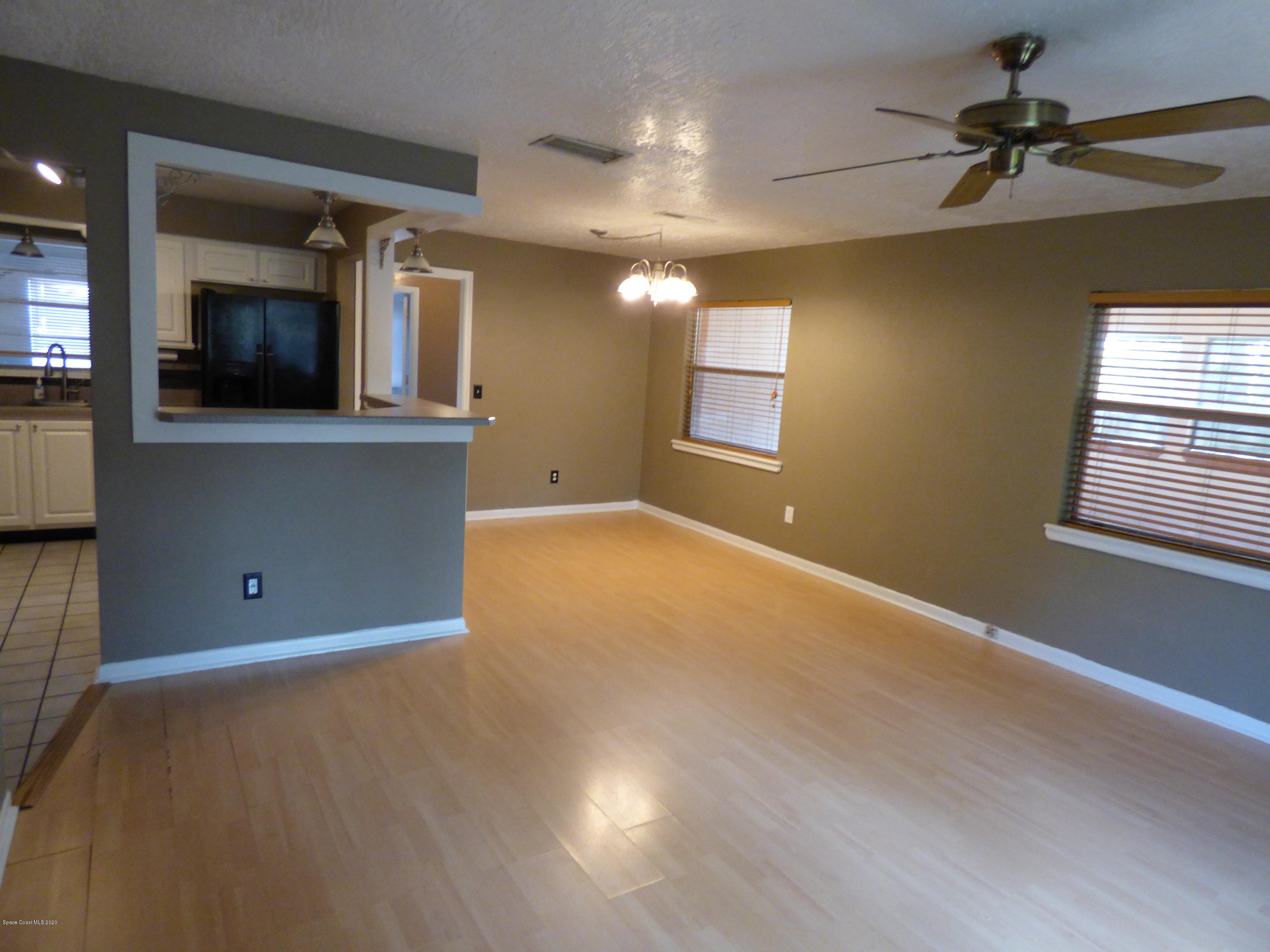 2802 Cherbourg Road Cocoa, FL 32926 - Photo 2 of 24 Great Room to Dining
