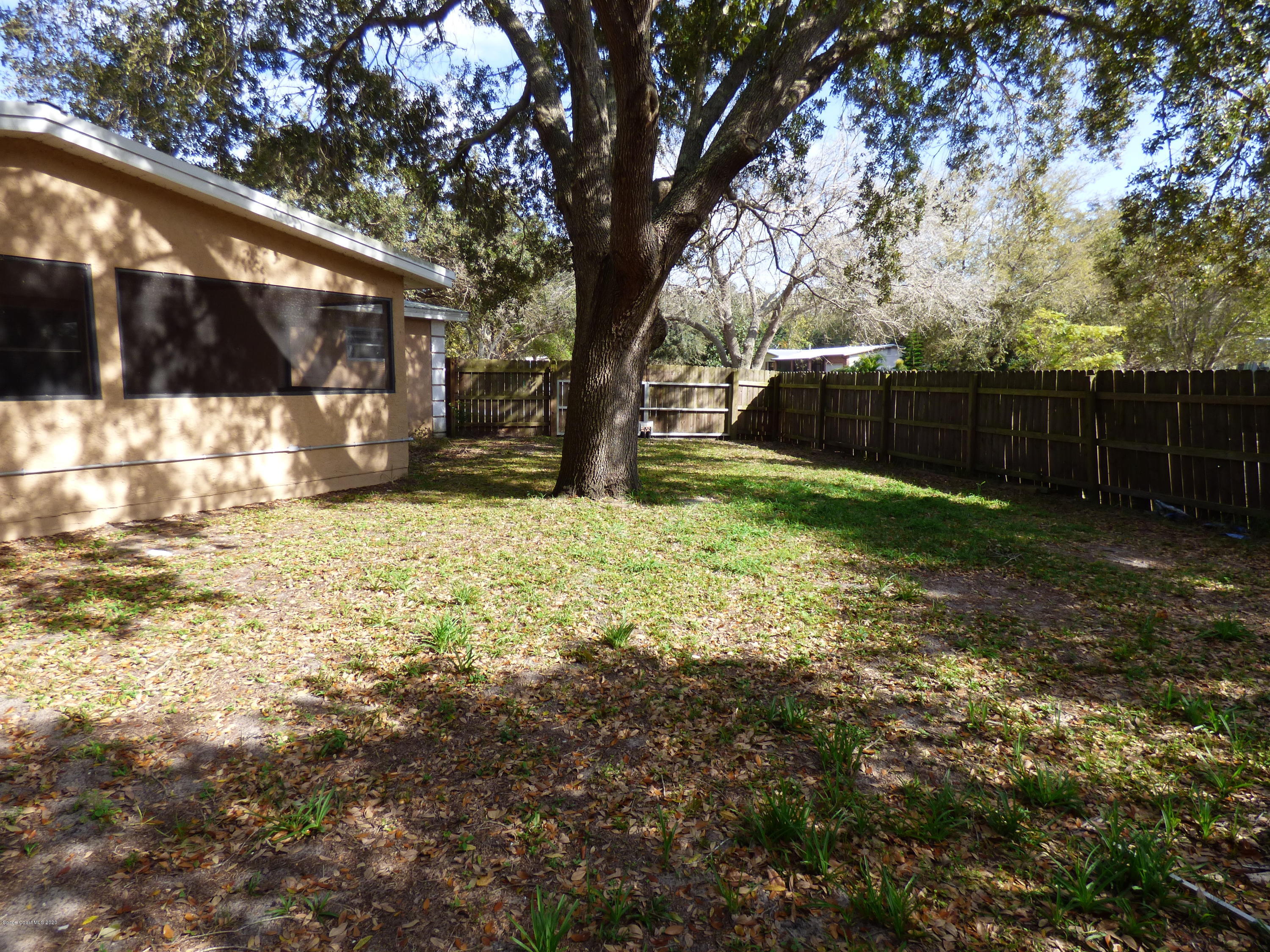 2802 Cherbourg Road Cocoa, FL 32926 - Photo 19 of 24 Fenced Side Yard