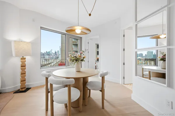 a view of a dining room with furniture and chandelier