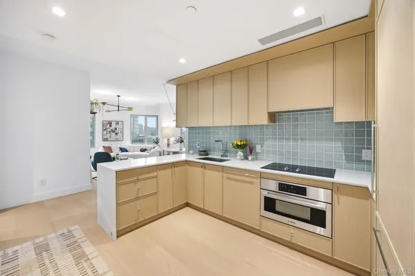 a kitchen with a sink cabinets and window