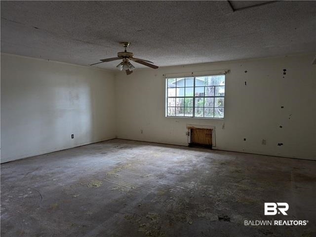 3817 Lansdowne Circle Mobile, AL 36693 - Photo 7 of 16 Unfurnished room featuring a textured ceiling and ceiling fan
