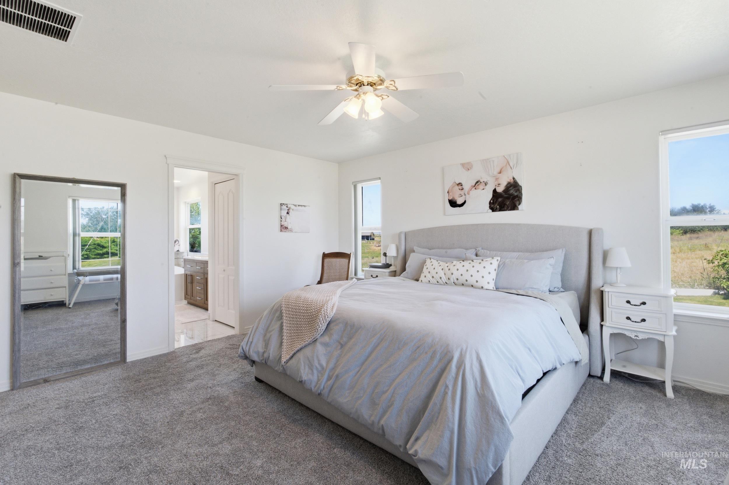 7781 Redmon Road Caldwell, ID 83607 - Photo 40 of 50 Vaulted ceiling with light-colored walls and a vibrant accent wall