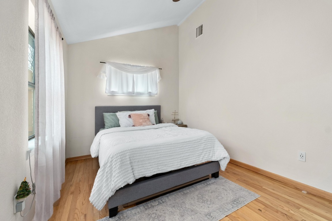 4610 Avenue B, Unit B Austin, TX 78751 - Photo 11 of 22 Bedroom with lofted ceiling and light wood-style floors