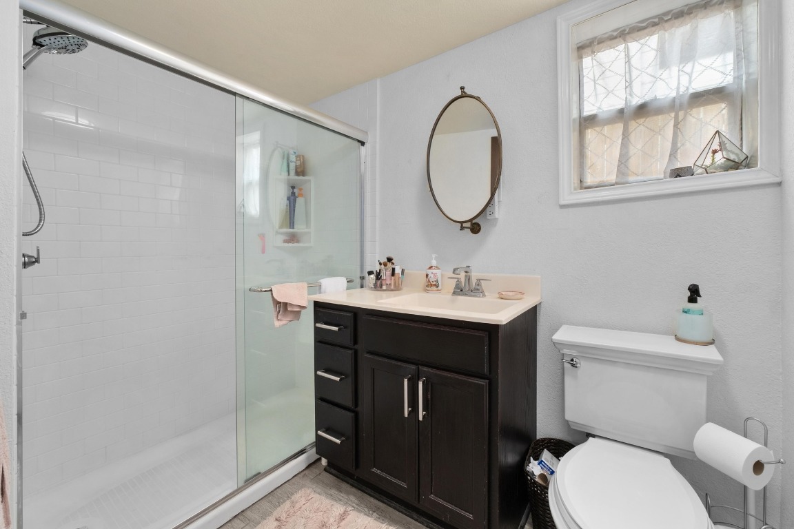 4610 Avenue B, Unit B Austin, TX 78751 - Photo 14 of 22 Full bathroom with vanity and a shower stall