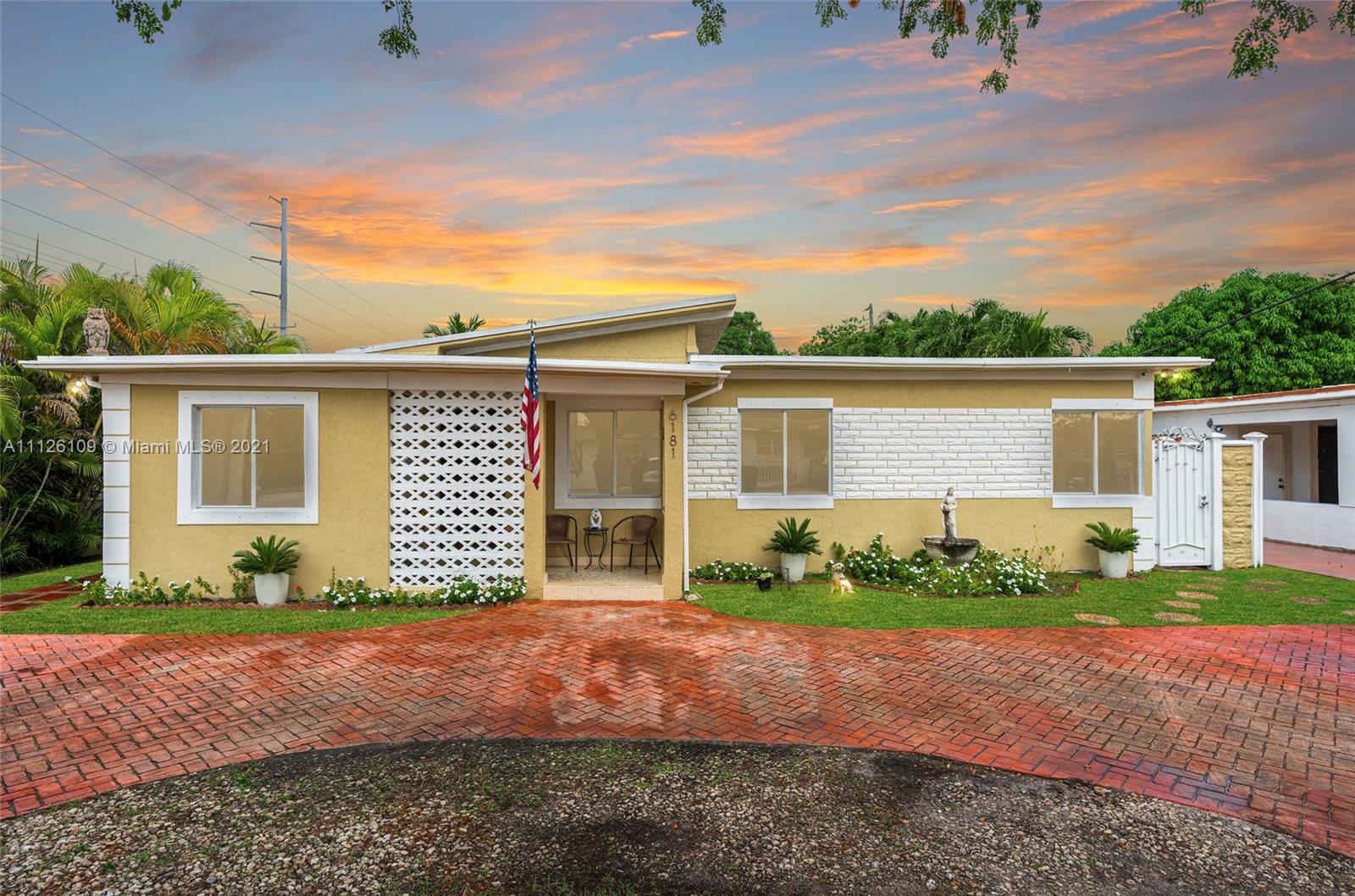 6181 Southwest 20th Street West Miami, FL 33155 - Photo 2 of 31 front view of a house with a yard