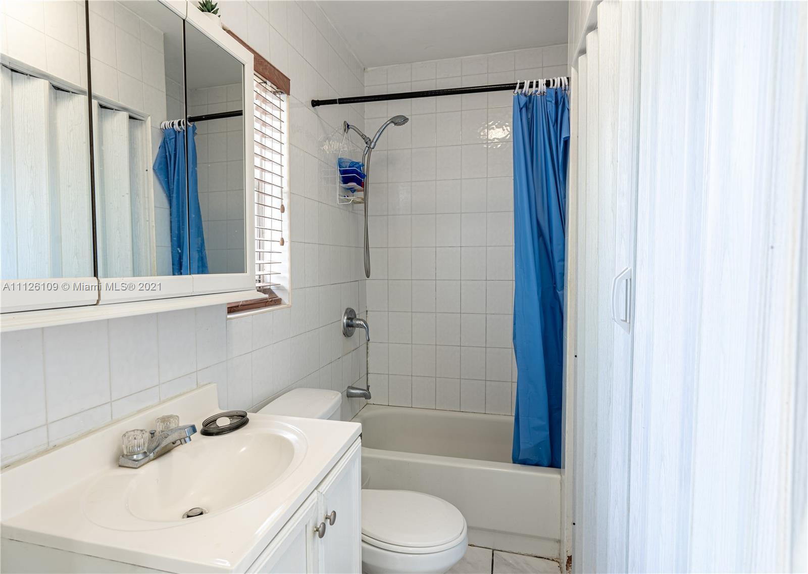6181 Southwest 20th Street West Miami, FL 33155 - Photo 16 of 31 a bathroom with a sink toilet tub and shower