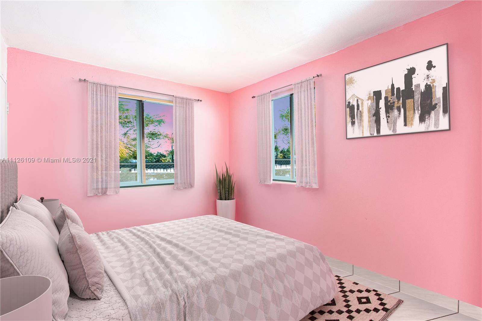 6181 Southwest 20th Street West Miami, FL 33155 - Photo 6 of 31 a bedroom with a bed and a window