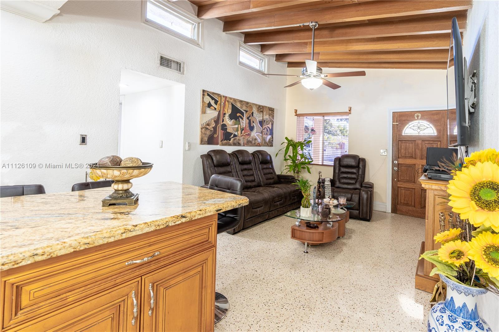 6181 Southwest 20th Street West Miami, FL 33155 - Photo 10 of 31 a living room with furniture and a chandelier