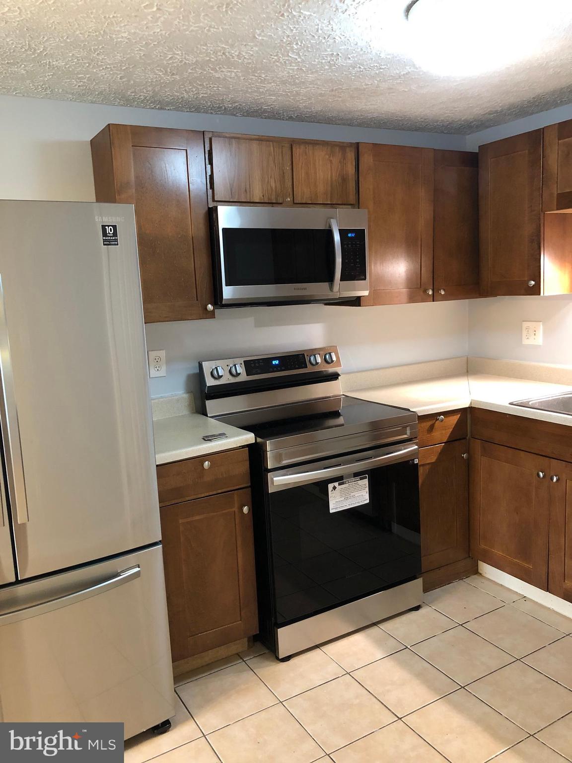 11228 Legato Way Silver Spring, MD 20901 - Photo 12 of 31 KITCHEN WITH NICE CABINET