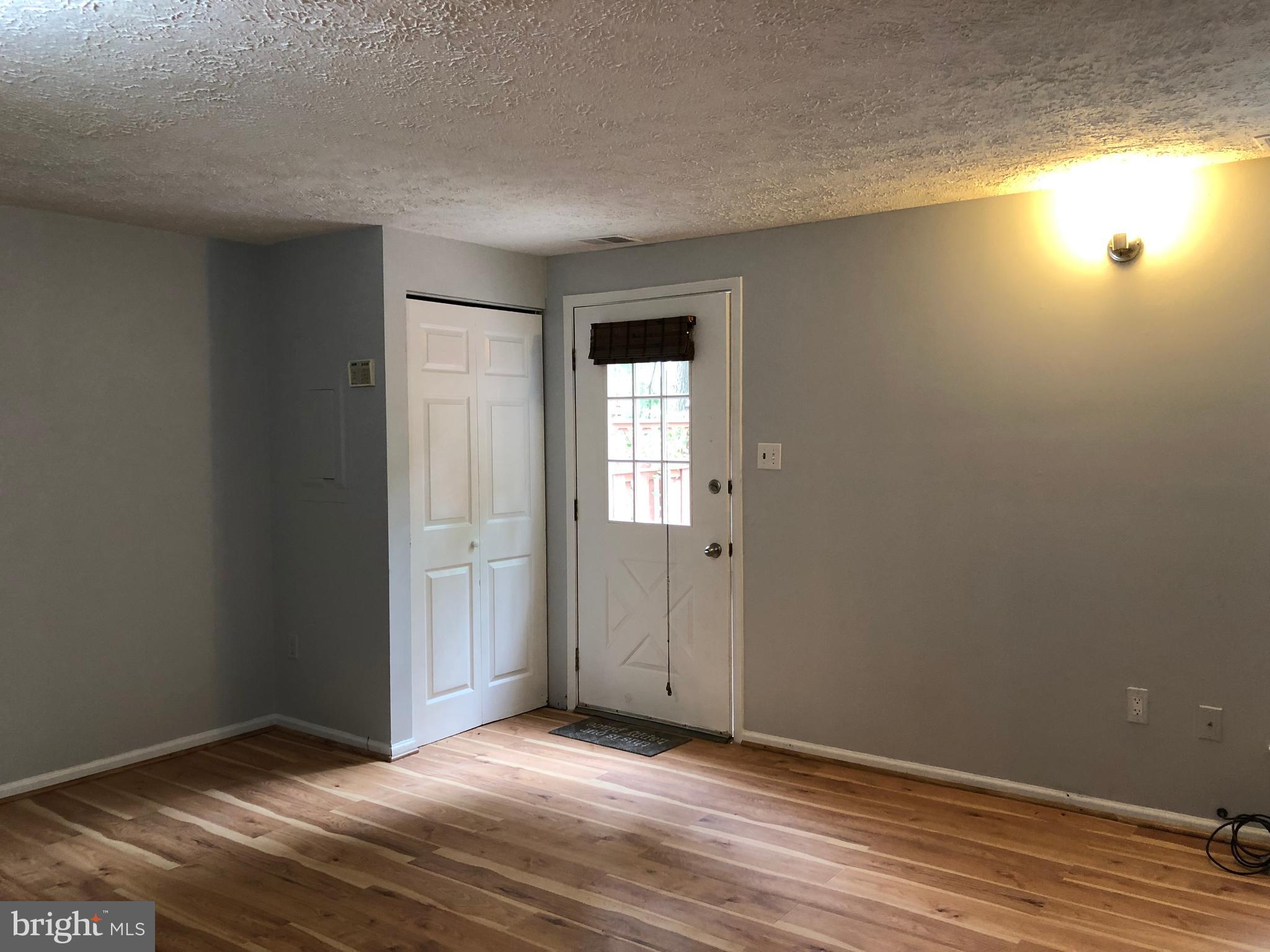 11228 Legato Way Silver Spring, MD 20901 - Photo 8 of 31 LIVING ROOM WITH COAT CLOSET