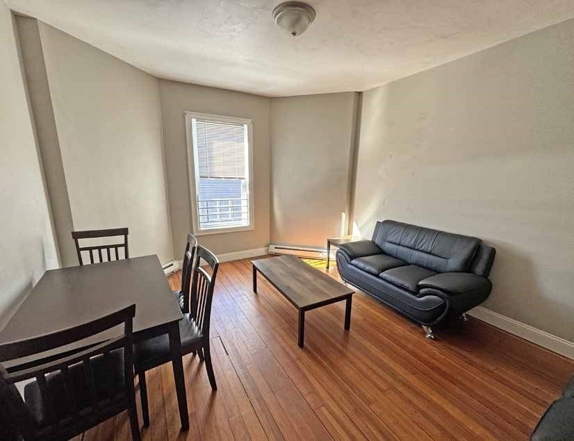 190 Washington Street Lynn, MA 01902 - Photo 13 of 19 a living room with furniture and a wooden floor