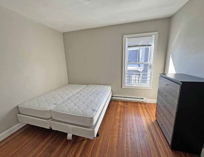 190 Washington Street Lynn, MA 01902 - Photo 14 of 19 wooden floor in a room next to a window