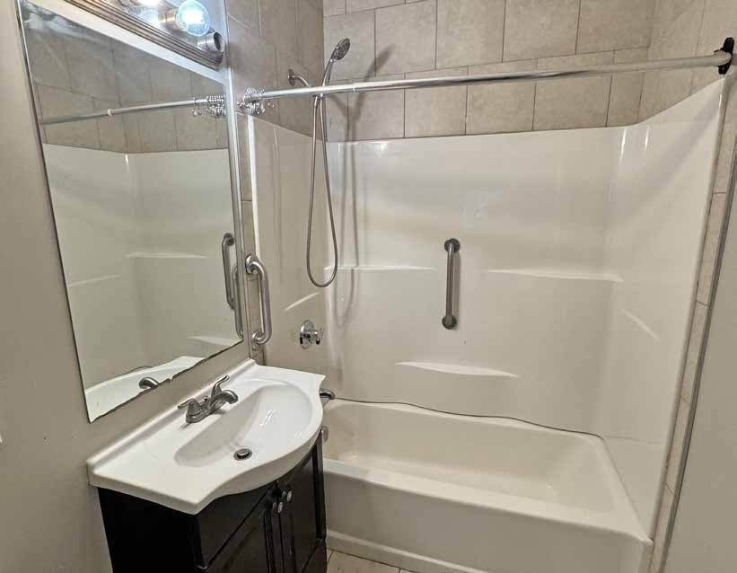 190 Washington Street Lynn, MA 01902 - Photo 16 of 19 a bathroom with a sink and mirror