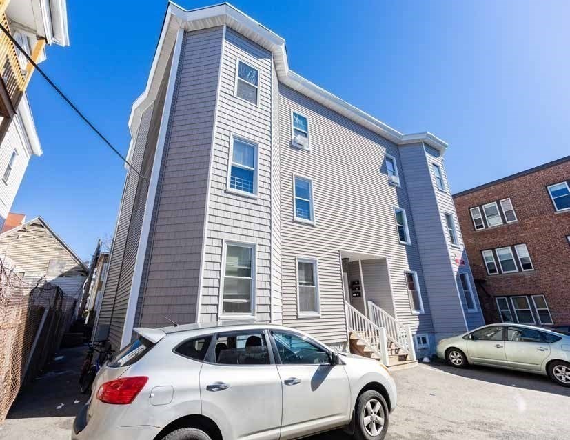 190 Washington Street Lynn, MA 01902 - Photo 4 of 19 a front view of a house with parking space