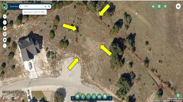 a view of a lake with houses in the back