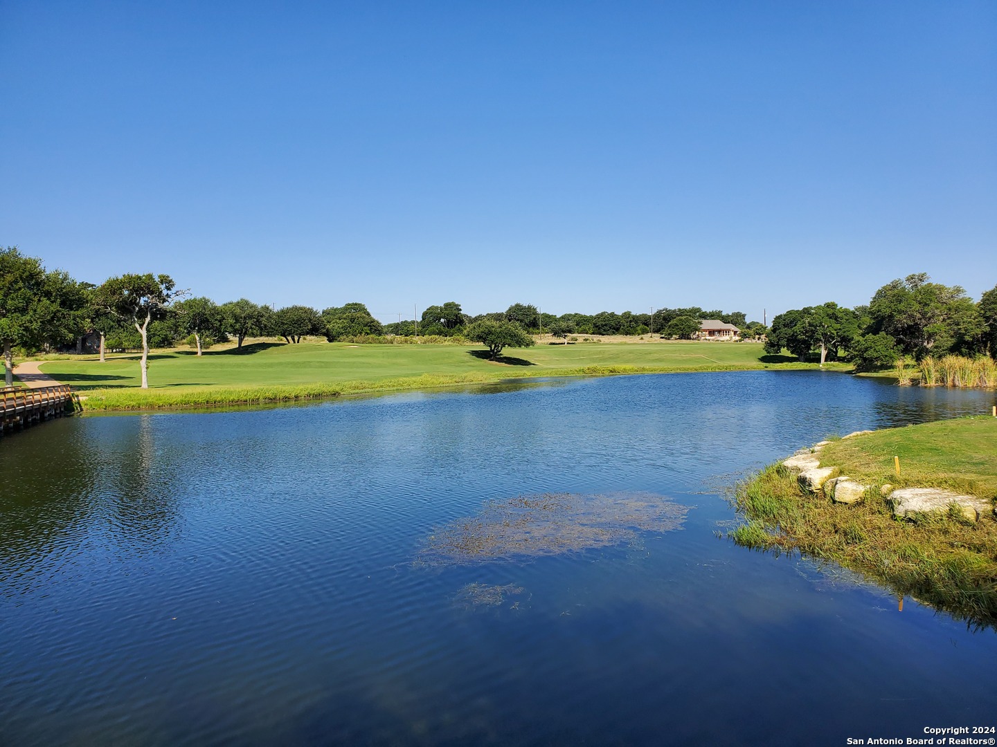 112 West Alex Jordan Blanco, TX 78606 - Photo 22 of 33 a view of a lake with houses in the back