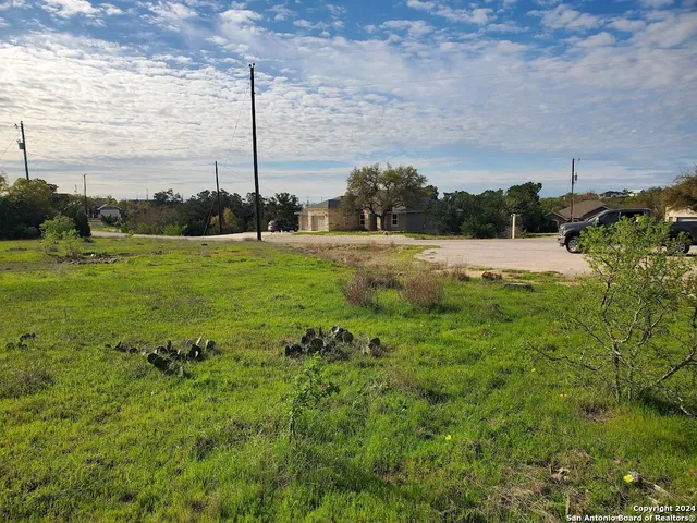 a view of a garden with lawn chairs